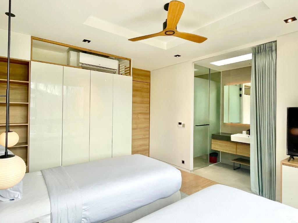 Postel nebo postele na pokoji v ubytování Moon Villa Phu Quoc - 3 Bedroom - Private pool