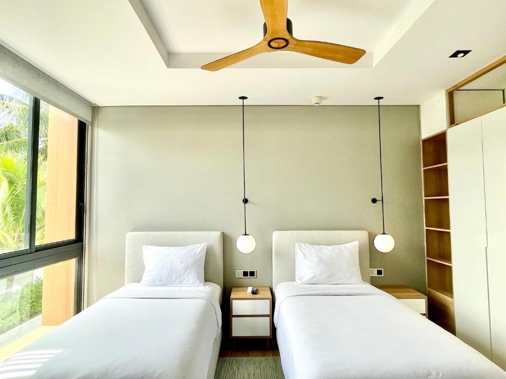 Postel nebo postele na pokoji v ubytování Moon Villa Phu Quoc - 3 Bedroom - Private pool