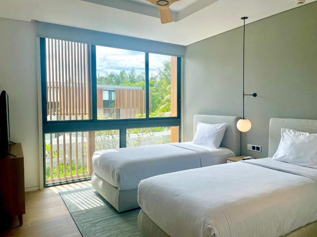 Postel nebo postele na pokoji v ubytování Moon Villa Phu Quoc - 3 Bedroom - Private pool