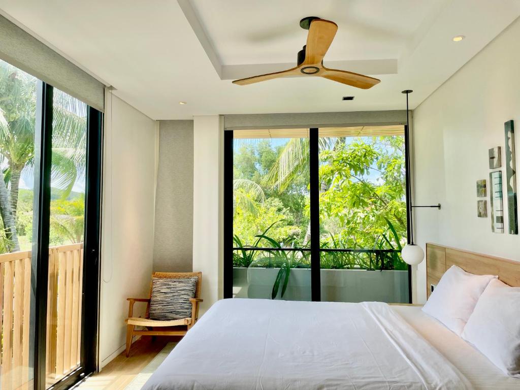 Postel nebo postele na pokoji v ubytování Moon Villa Phu Quoc - 3 Bedroom - Private pool