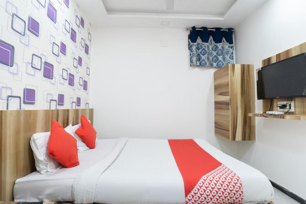 Postel nebo postele na pokoji v ubytování Hotel O Swell