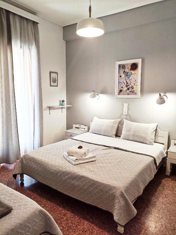 Postel nebo postele na pokoji v ubytování Apartments Papadioti