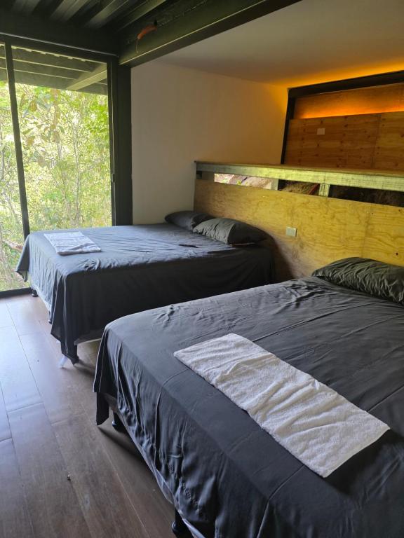 Postel nebo postele na pokoji v ubytování De La Cascata Glamping