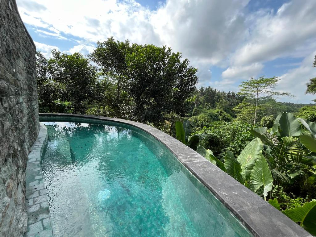 Bazén v ubytování D'Nanda mini hotel Ubud nebo v jeho okolí