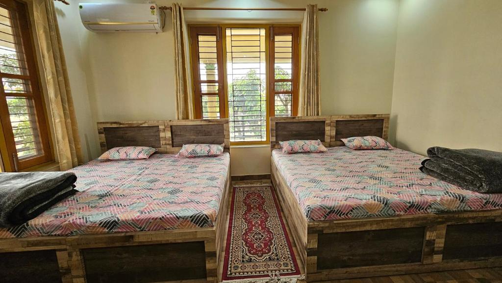 Postel nebo postele na pokoji v ubytování Bora's Homestay