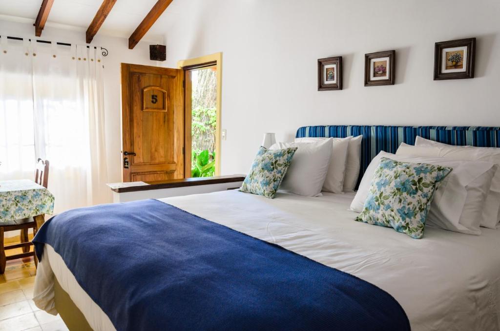 Postel nebo postele na pokoji v ubytování La Casona Hotel Boutique