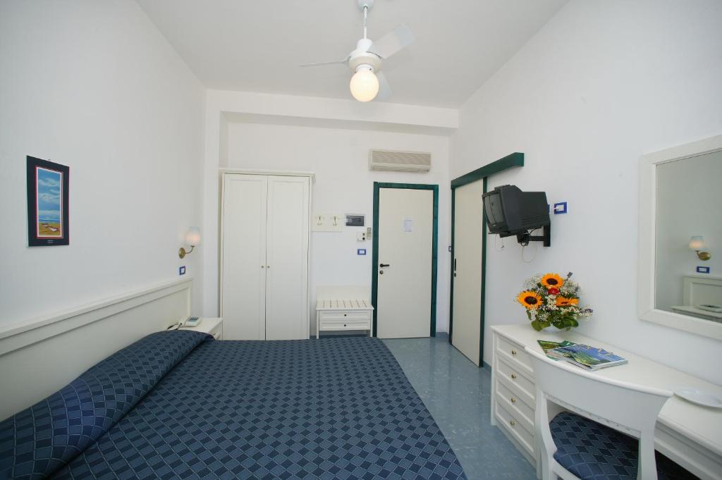 Postel nebo postele na pokoji v ubytování Hotel Elisa - Spiaggia Privata Inclusa