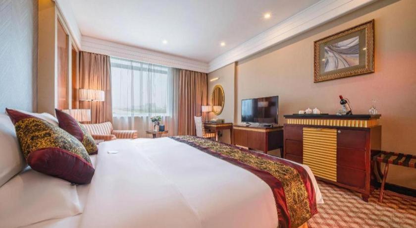 Postel nebo postele na pokoji v ubytování Nanning Yongjiang Hotel