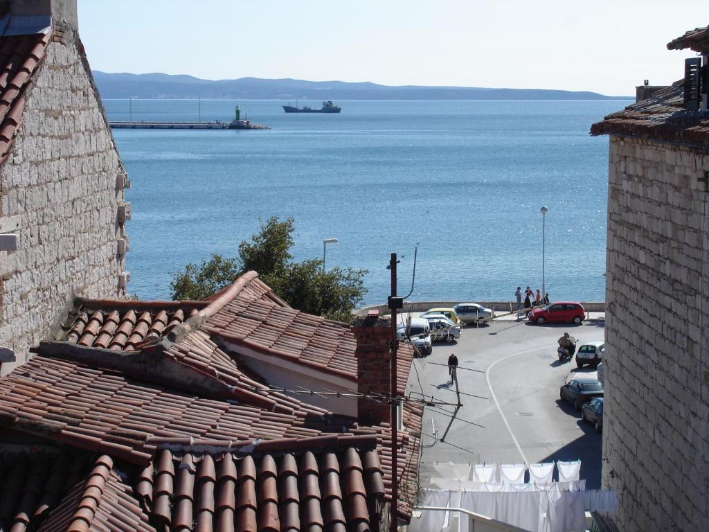 a view of a parking lot next to the water at Bruno Split Centre Apartment and Room in Split