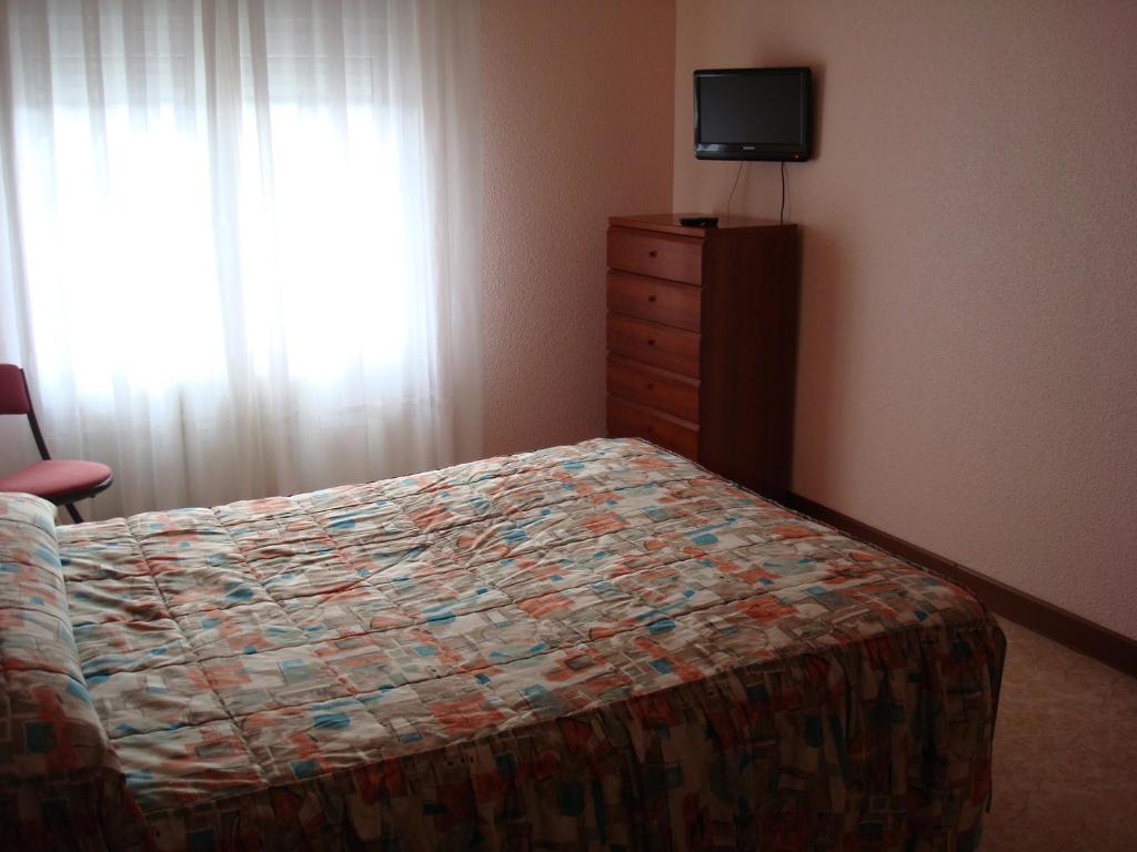 Cama o camas de una habitación en Hostal Hermanos Gutierrez