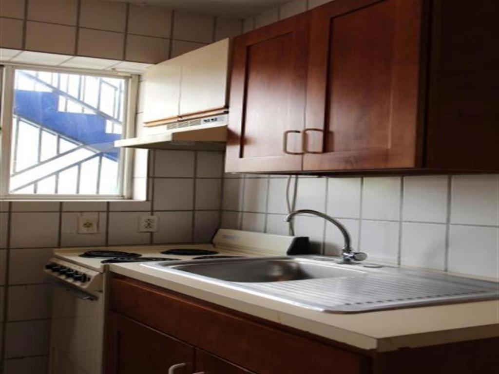 Kuchyň nebo kuchyňský kout v ubytování Curacao Lodge