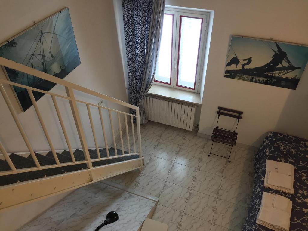 Postel nebo postele na pokoji v ubytování Camere Da Aldo in centro Sirolo