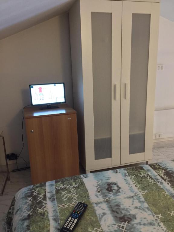 Postel nebo postele na pokoji v ubytování Camere Da Aldo in centro Sirolo