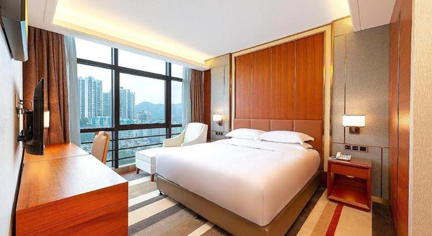 Postel nebo postele na pokoji v ubytování MeiQiu-Fino Hotel