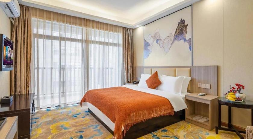 Postel nebo postele na pokoji v ubytování Oriental Hotel