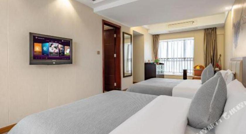 Postel nebo postele na pokoji v ubytování Oriental Hotel