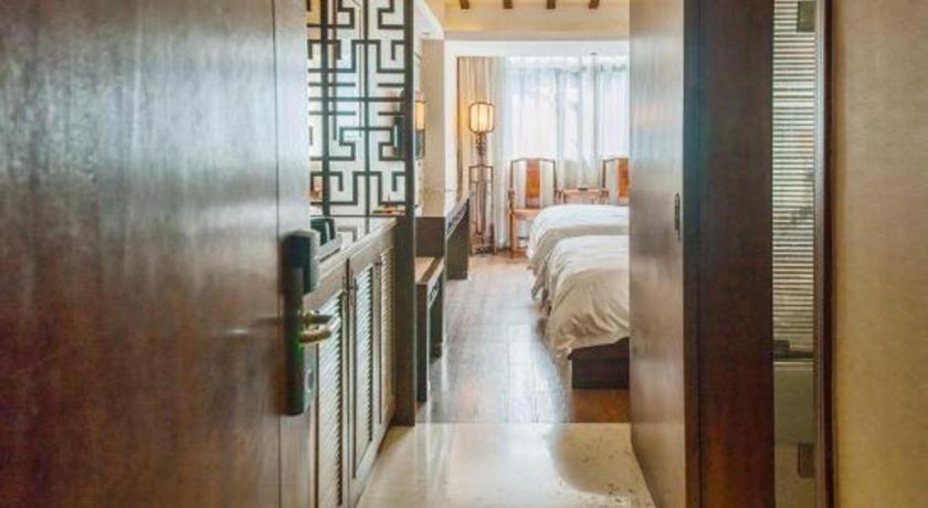 Postel nebo postele na pokoji v ubytování Oriental Hotel