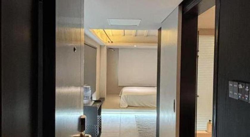Postel nebo postele na pokoji v ubytování Oriental Hotel
