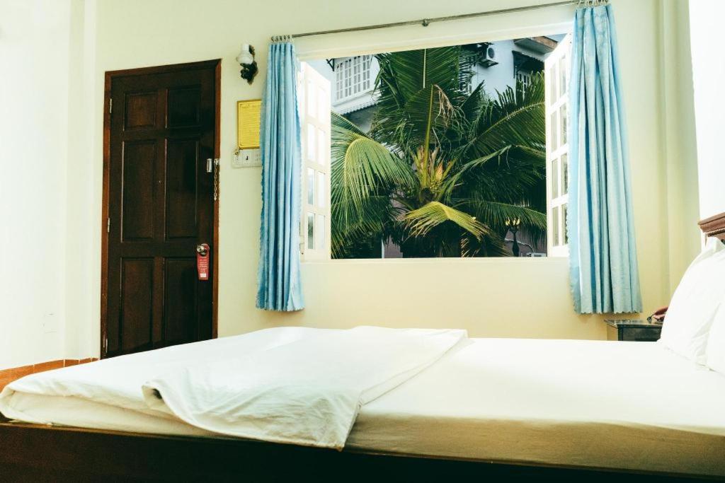 Postel nebo postele na pokoji v ubytování Diamond Resort Bien Hoa