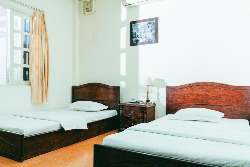 Postel nebo postele na pokoji v ubytování Diamond Resort Bien Hoa