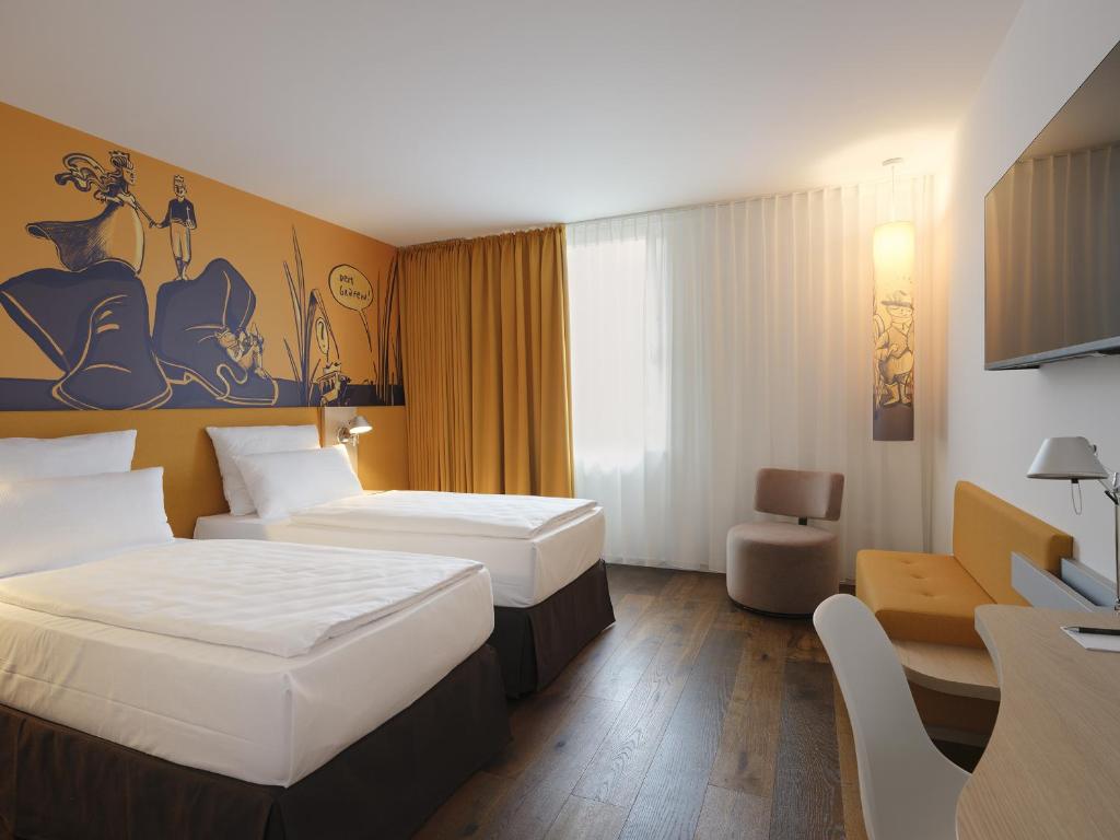 Postel nebo postele na pokoji v ubytování Grimms Hotel Hanau