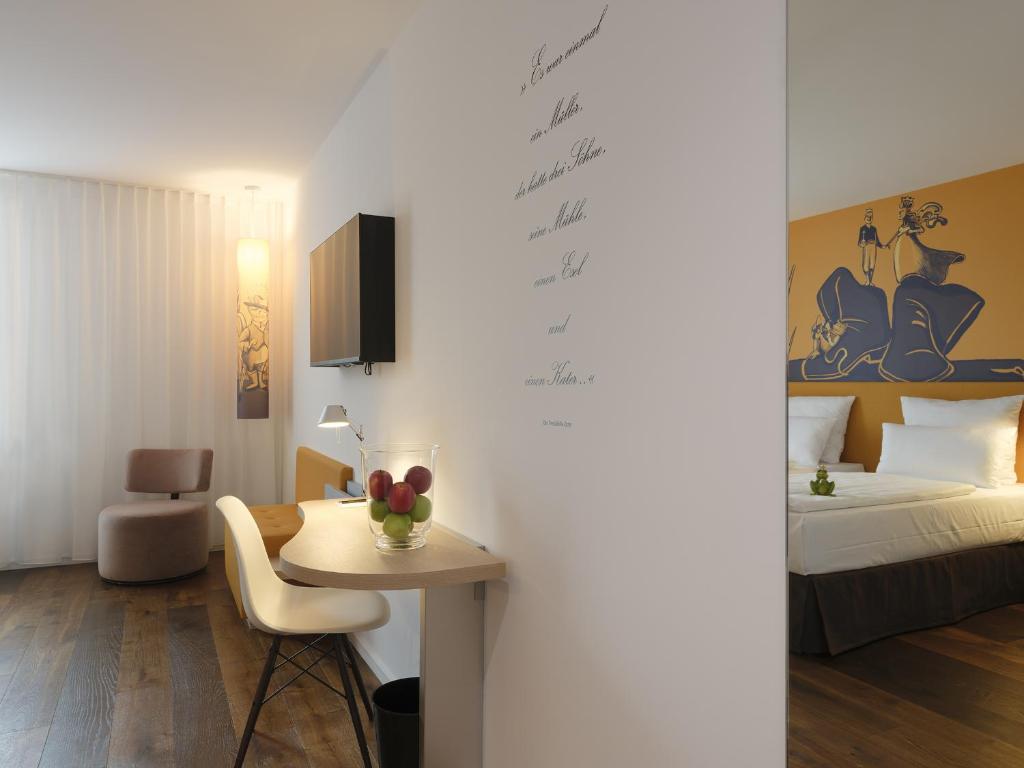 Postel nebo postele na pokoji v ubytování Grimms Hotel Hanau