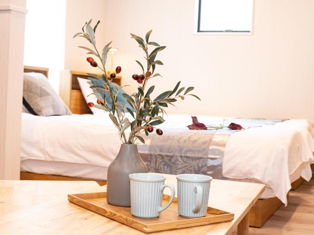 Postel nebo postele na pokoji v ubytování HOTEL StayLuck KOTOHIRA