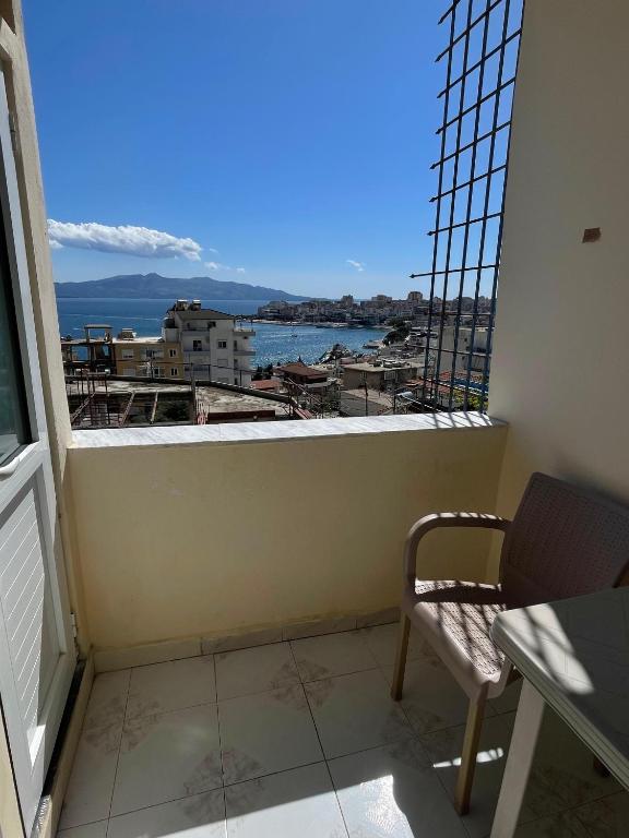 a balcony with a view of the water at Hotel Gjika in Sarandë