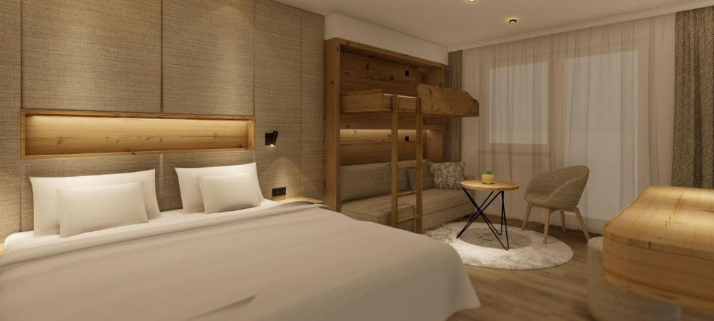 A bed or beds in a room at Hotel Zauchenseehof