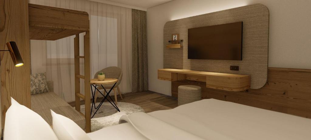 A bed or beds in a room at Hotel Zauchenseehof