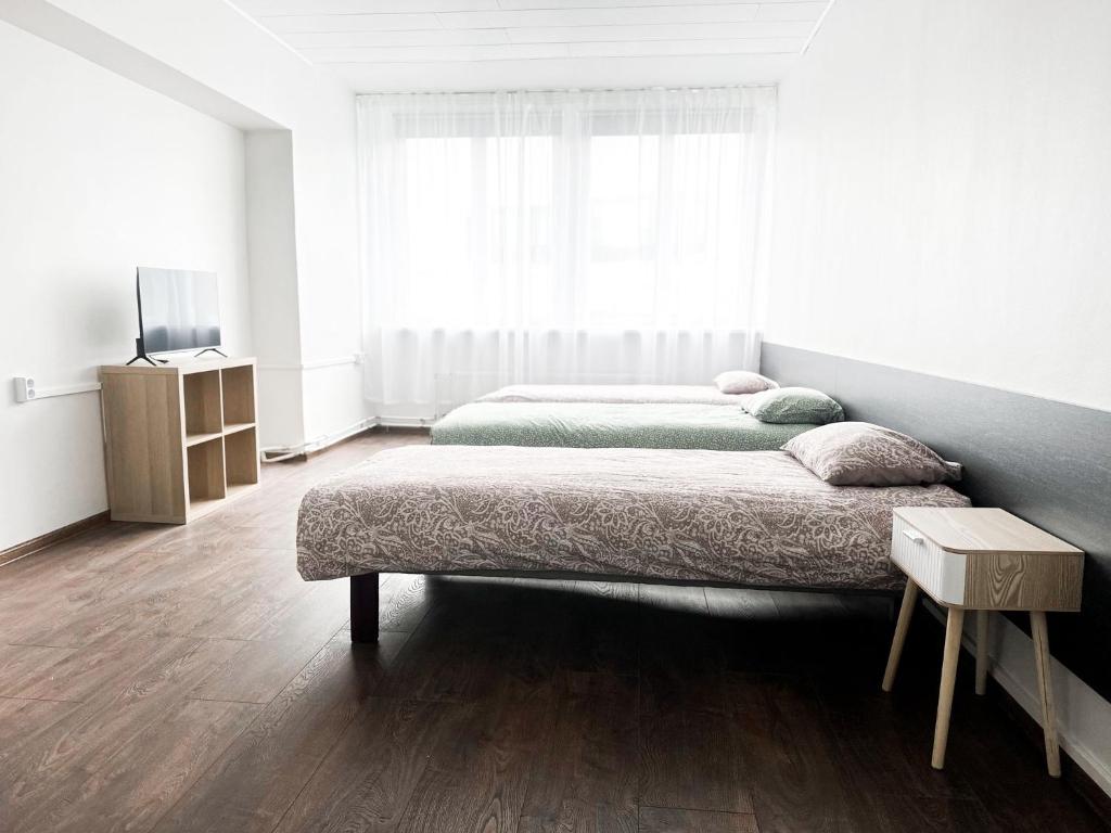 Postel nebo postele na pokoji v ubytování Kerese Beach House