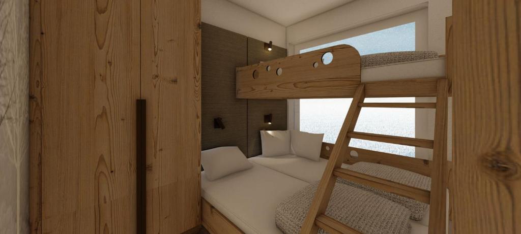 A bed or beds in a room at Hotel Zauchenseehof