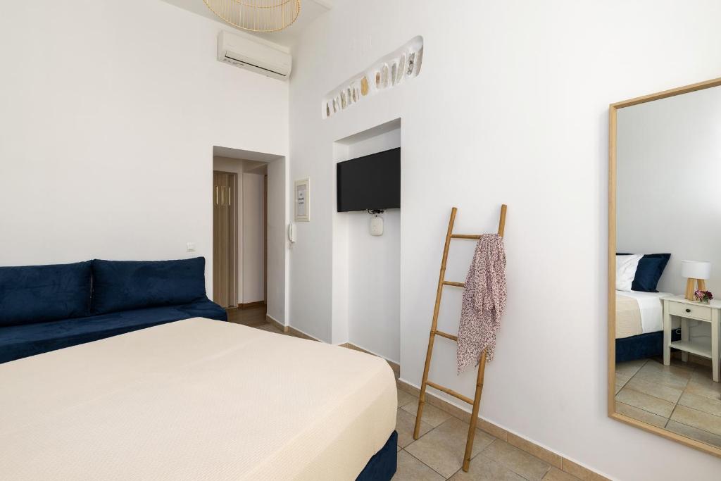 Postel nebo postele na pokoji v ubytování Irene Studios