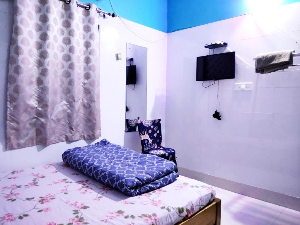 Postel nebo postele na pokoji v ubytování Okaasan Guest House