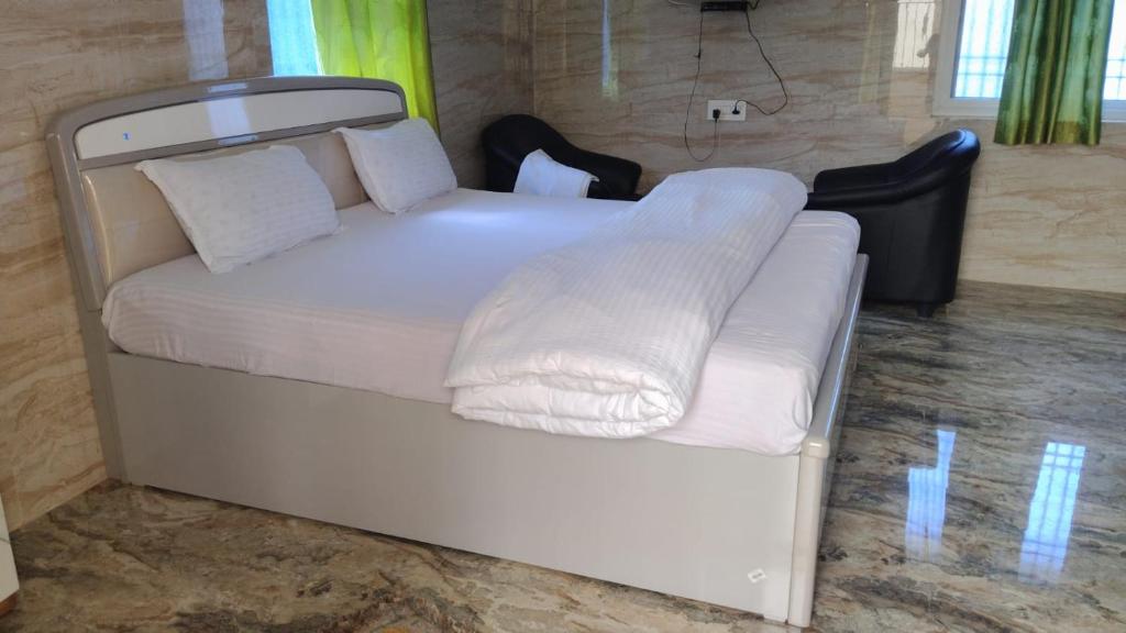 Postel nebo postele na pokoji v ubytování Okaasan Guest House