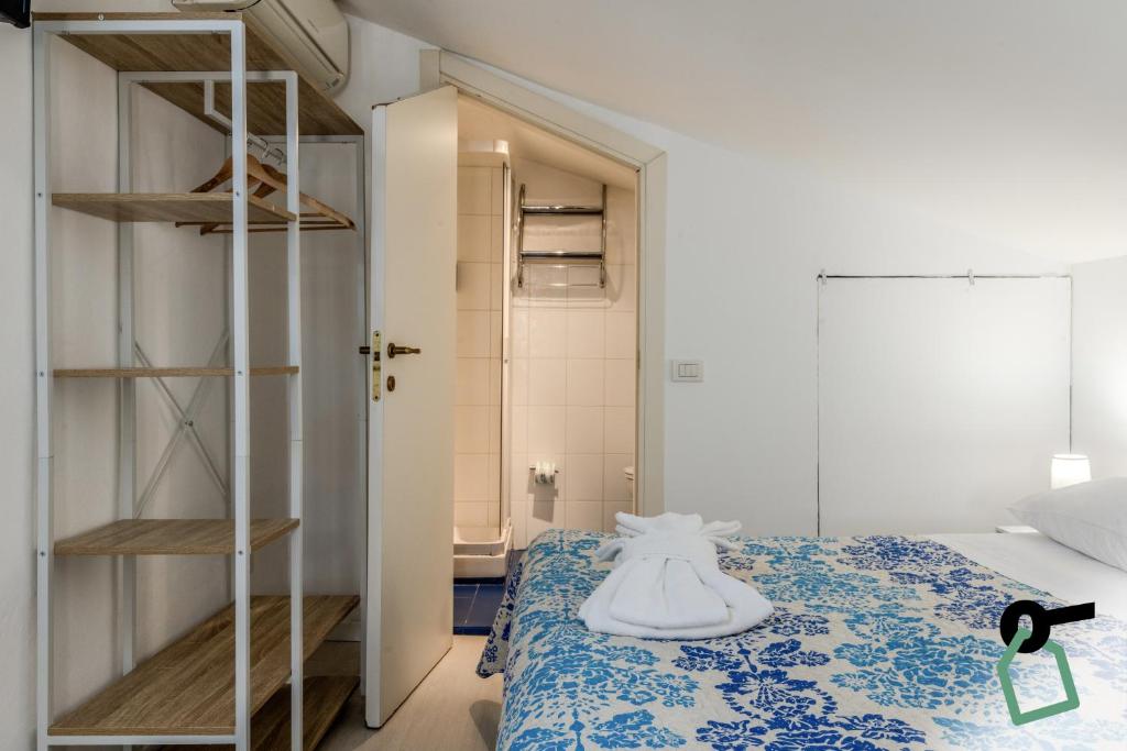 Postel nebo postele na pokoji v ubytování HOTIDAY Room Collection - Ortigia Opera