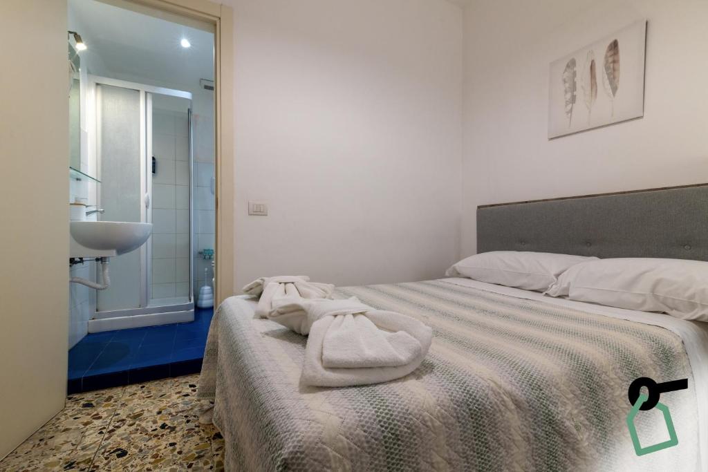 Postel nebo postele na pokoji v ubytování HOTIDAY Room Collection - Ortigia Opera