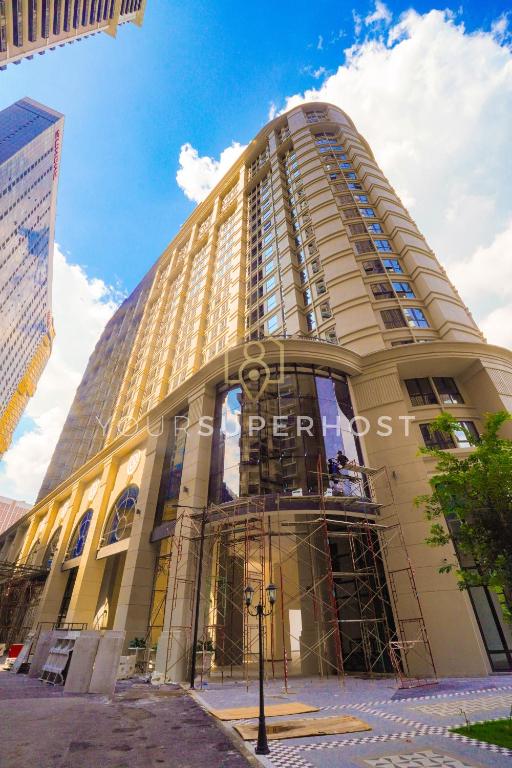 a large building with a sign on the front of it at Paxtonz by YourSuperhost in Kuala Lumpur