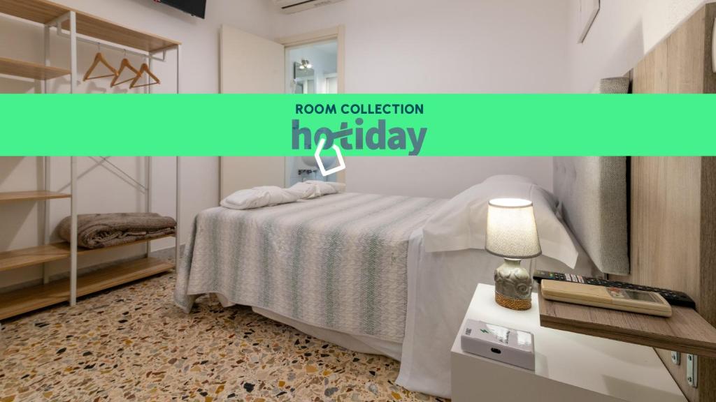 Postel nebo postele na pokoji v ubytování HOTIDAY Room Collection - Ortigia Opera