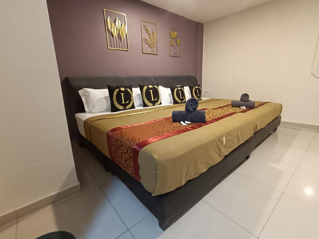 Postel nebo postele na pokoji v ubytování L Ferringhi Hotel