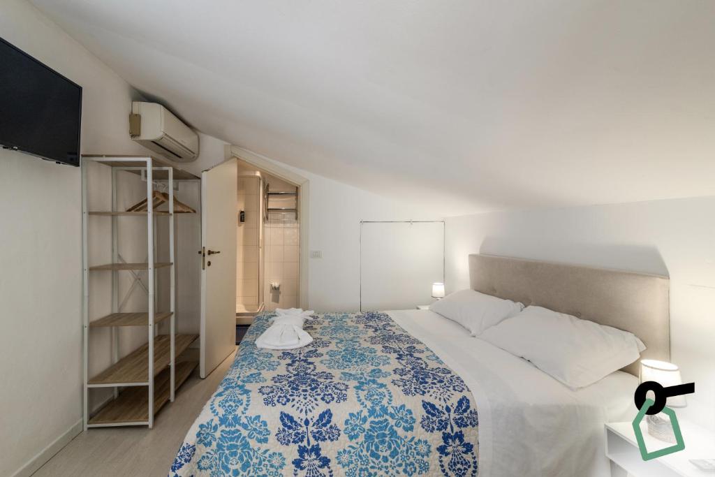 Postel nebo postele na pokoji v ubytování HOTIDAY Room Collection - Ortigia Opera