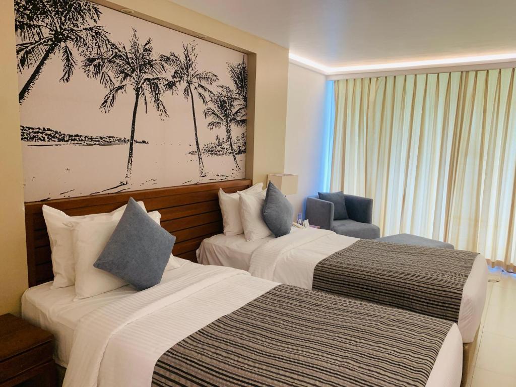 Postel nebo postele na pokoji v ubytování Pegasus Reef - A Beach Resort in Colombo