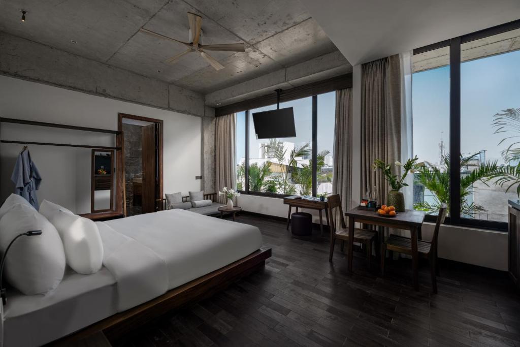 Giường trong phòng chung tại Thè HEM Hotel and Apartment