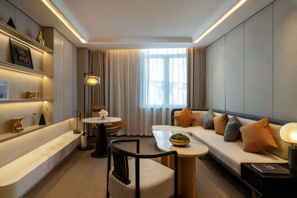 Posezení v ubytování 上海虹桥荷逸唐酒店北新泾地铁站Shanghai Hongqiao Heyitang Hotel Beixinjing Subway Station Branch