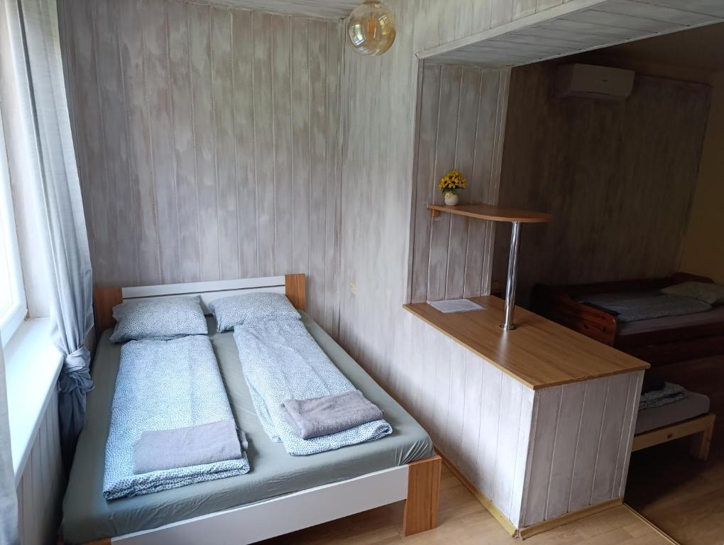 A bed or beds in a room at Village Park