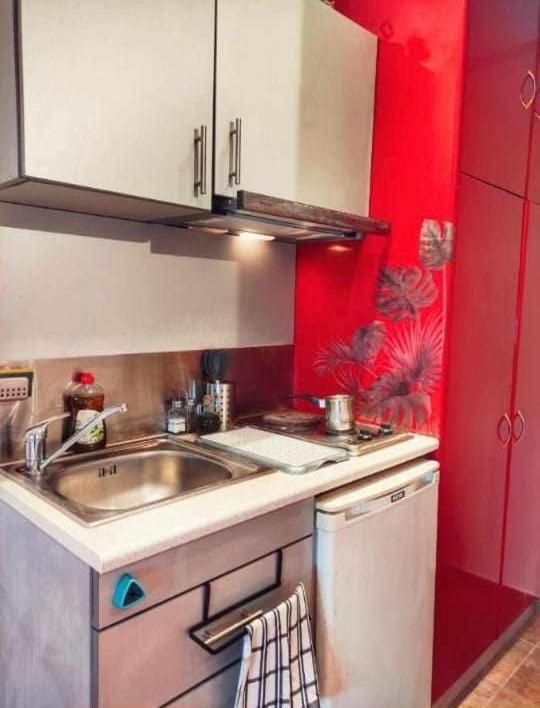 Kuchyň nebo kuchyňský kout v ubytování Rena's Rooms Μελίντα