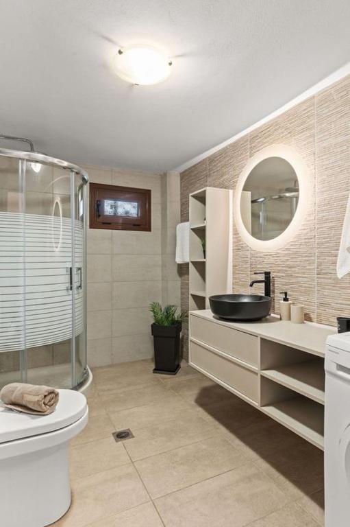 A bathroom at MD Residence with private jacuzzi near the beach