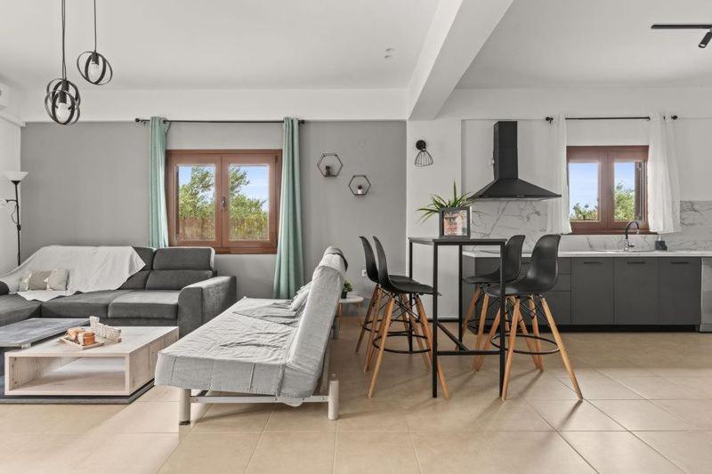A seating area at MD Residence with private jacuzzi near the beach