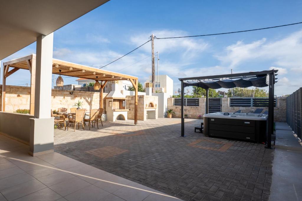 A patio or other outdoor area at MD Residence with private jacuzzi near the beach