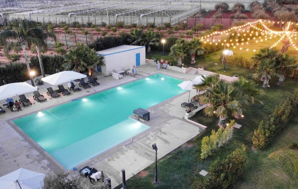 an overhead view of a swimming pool at a resort at Gorgeous Home In Acate in Acate